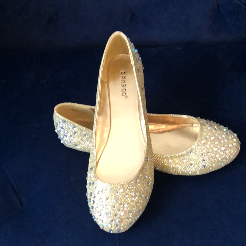 Beautiful gold flats with rhinestones. Never worn. Brand new.
